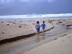 This is REALLY a beach.  Nice orange coloured stagnant water flowing into the ocean...